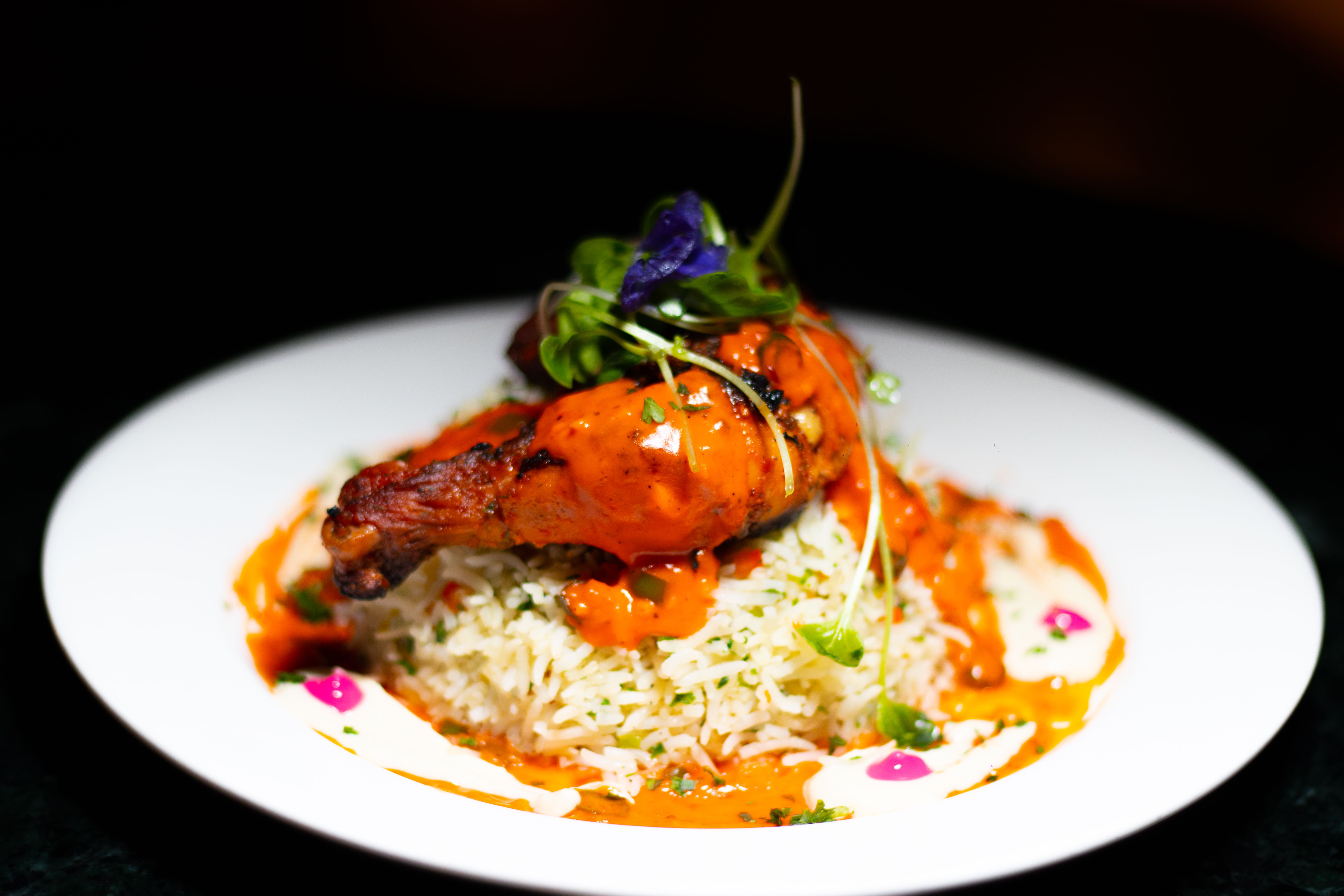 Curry and naan on a white plate