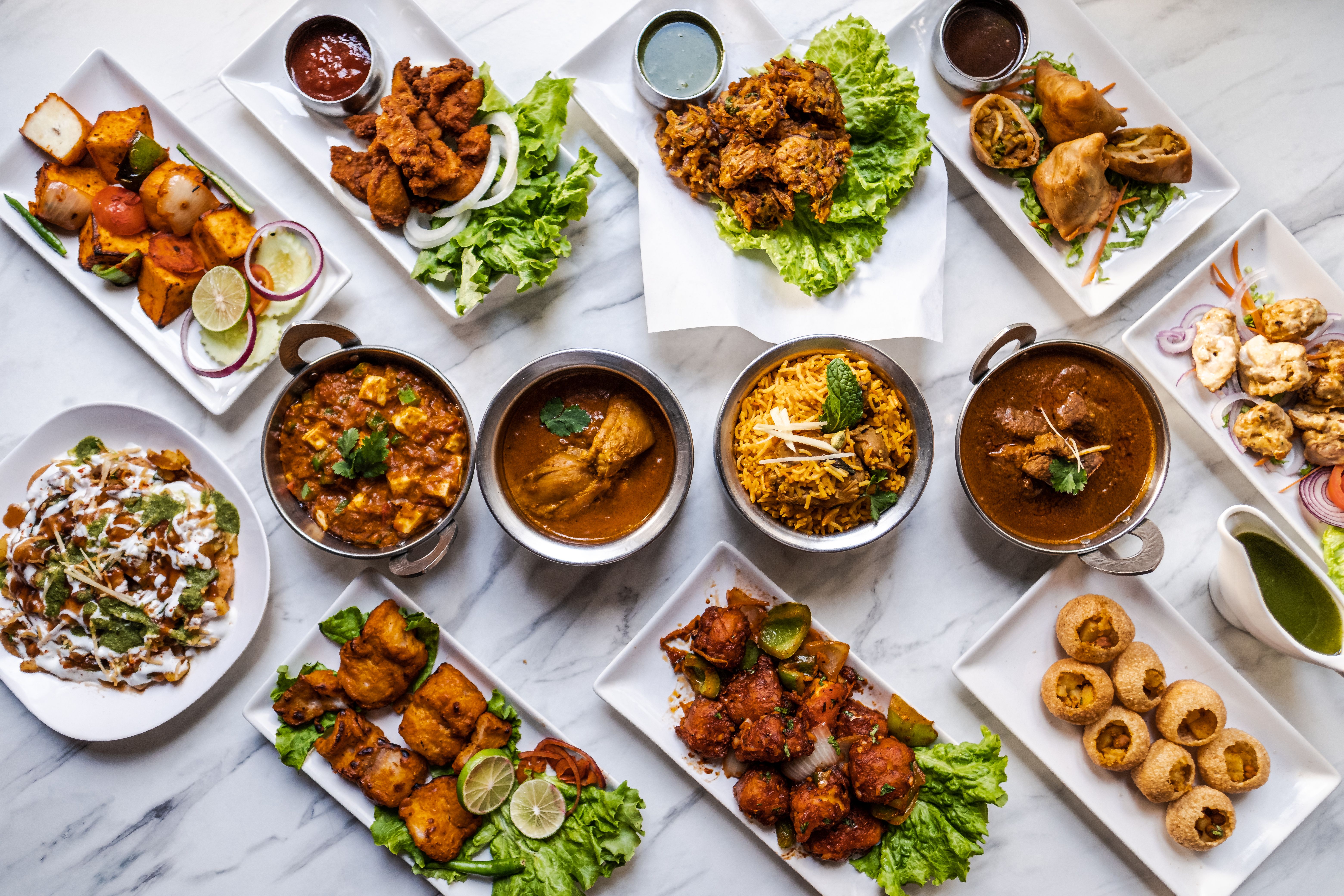 Spread of Indian dishes on the table